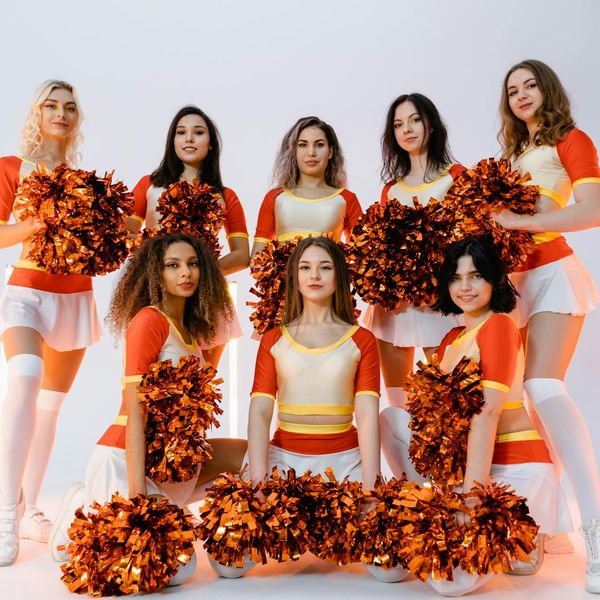 A group of people smiling and feeling refreshed in a bright studio.